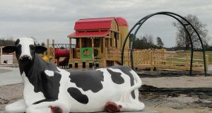 Bessie the cow and her barn at Knightdale Station Park - Asheville Playgrounds