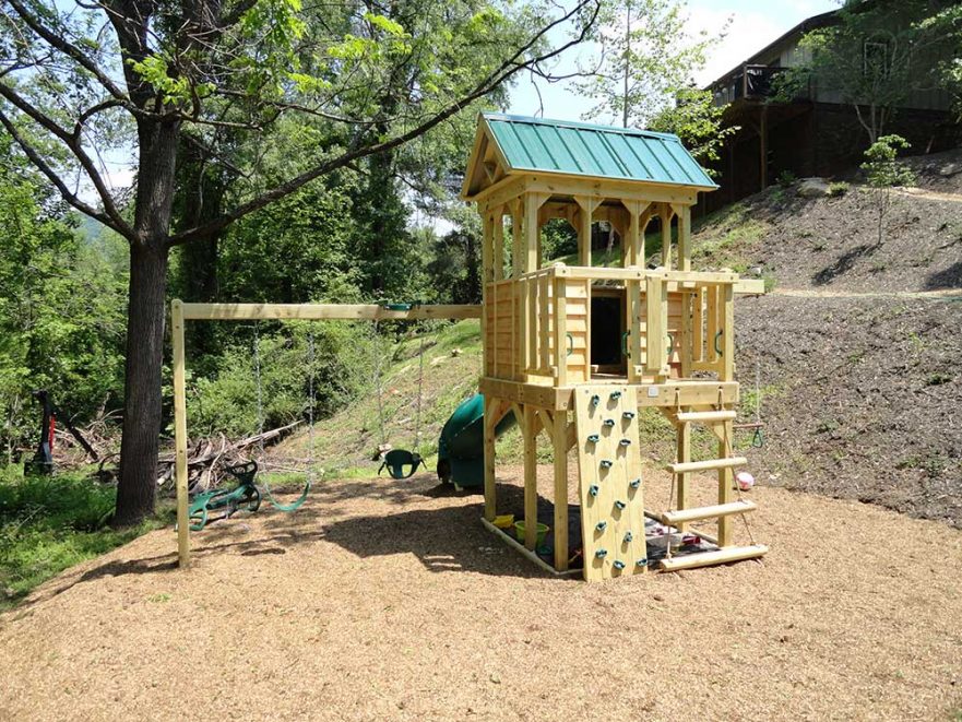 Fort With Log Climber Rock Wall and Swings