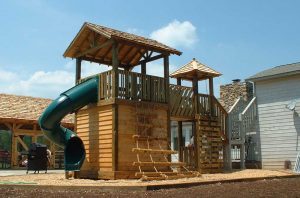 Large cedar lap fort with tube slide and log climber - Asheville Playgrounds
