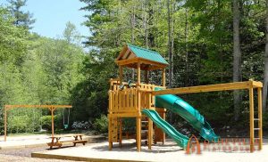 Multi-level playground with monkey bars and separate swings at Champion Hills in Hendersonville, NC - Asheville Playgrounds