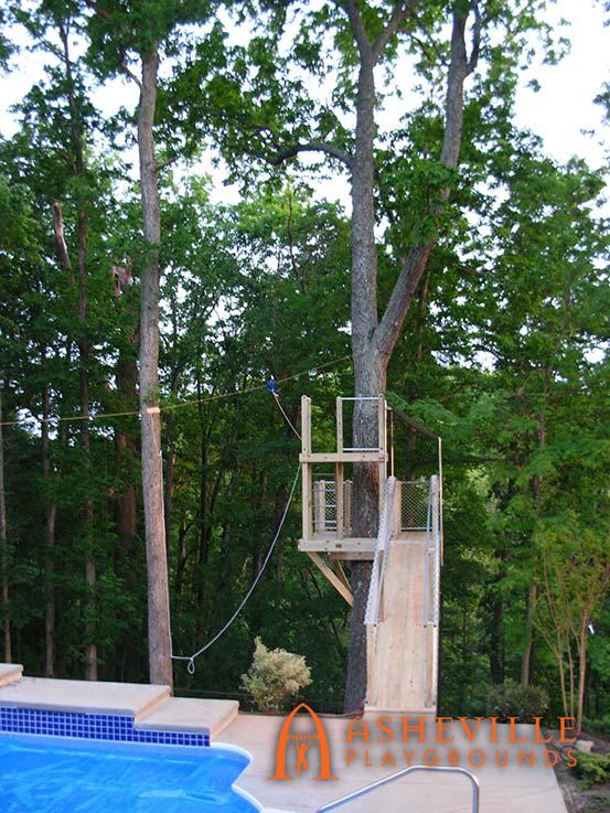 Tree Deck with Zip Line Running Over the Pool