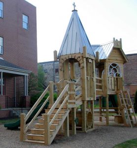 Roofs, windows and architectural details of this playground mimic the church in Decatur, AL - Asheville Playgrounds