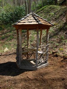 Rustic little gazebo big enough for two - Asheville Playgrounds