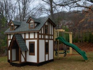 Tudor playhouse mirrors the tudor home it sits across from - Asheville Playgrounds