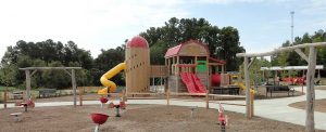 Barn and silo playground with tot corral in foreground in Knightdale Station Park, NC - Asheville Playgrounds
